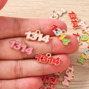 Detailed macro of 1314 number enamel charms for DIY jewelry making in pink and red