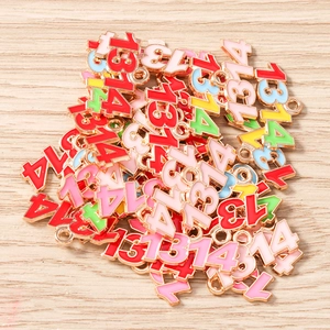 Macro shot of 1314 number alloy charms with colorful oil drip finish for DIY jewelry