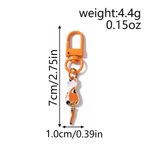 Detail of calico cat keychain with orange enamel finish including size and weight specs