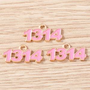 Detailed view of pink enamel number 1314 pendants with gold metal edges for DIY jewelry
