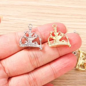 Detailed view of fountain shaped alloy charms for DIY necklaces in gold and silver finish
