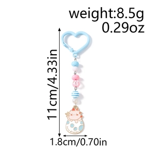 Vue détaillée du porte-clés œuf de dinosaure avec perles et dimensions 11cm par 1,8cm