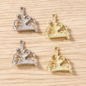 Macro detail of fountain-shaped alloy charms with rhinestones for DIY jewelry making