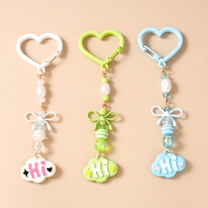 Porte-clés Doux Nuage à Nœud et Künstliche Perles Avec Crochet Cœur Charme de Sac en Résine pour Femmes Filles Cadeau Quotidien