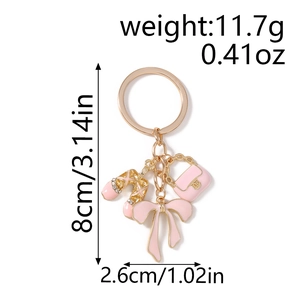 Pink ballet shoes and bow keychain with size annotations of 8cm height and 2.6cm width