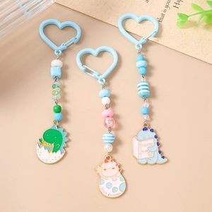 Porte-clés dinosaure avec perles colorées et fermoir en cœur pour décor de sac