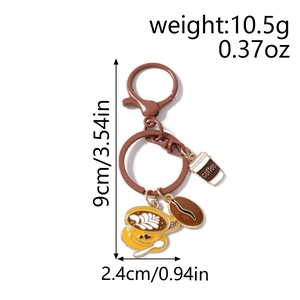 Detail view of coffee bean keychain with heart latte cup pendant and lobster clasp