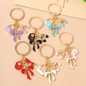 Fashion enamel keychains set with rhinestones, ballet shoes, bows and rose charms