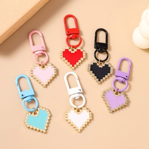 Set of six pixel heart keychains with gold-plated edges in multiple vibrant colors