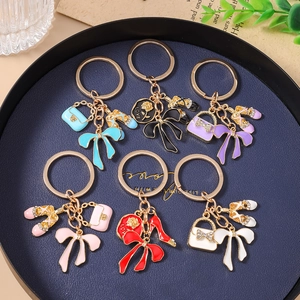 Fashionable rhinestone keychain set featuring colorful bow and high heel bag charms