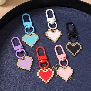 Detail view of colorful pixel heart keychains with matching lobster clasps in six colors