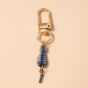 Detail of grey tabby cat keychain with a polished gold D-ring clasp and lobster hook