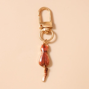 Detail showing the cute orange striped cat keychain with a movable metal tail component