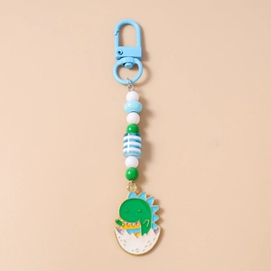 Detail of beaded dinosaur keychain with blue D-hook and striped pattern beads