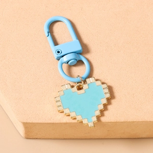 Detailed view of sky blue mosaic heart keychain with pixelated enamel pendant and gold edges