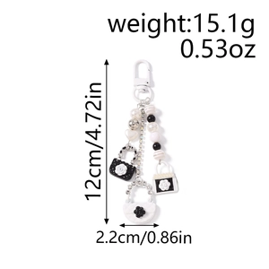 Detailansicht Schlüsselanhänger mit Handtaschenanhängern und Maßen von 12cm mal 2,2cm