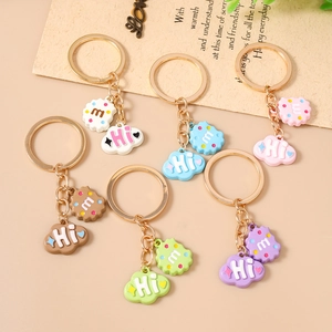 Set of 6 colorful cloud and cookie charm keychains with 'Hi' and 'm' letter patterns