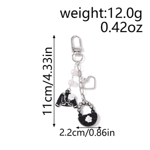 Detailed size and weight view of beaded heart keychain with stylish bag charms