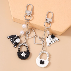 Elegant beaded heart keychain set with camellia and diamond-encrusted bag charm