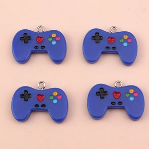 Macro detail of blue resin game controller charms with colorful buttons and silver rings