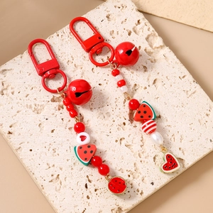 Handmade beaded watermelon keychain set with red bells and resin fruit pendants