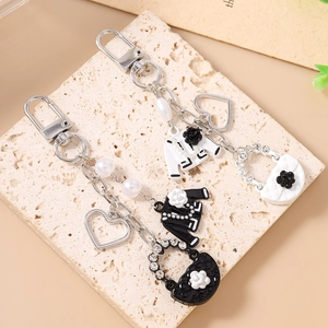 Elegant beaded heart keychain with pearl chain and fashion quilted bag charm on stone