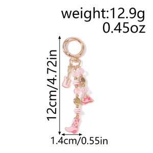 Pink guitar and cowboy boot keychain pendant with dimensions 12cm length and 1.4cm width