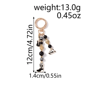 Western style beaded keychain with enamel guitar, cowboy hat and boot charms