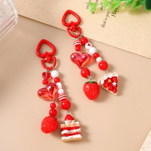 Cute red heart keychain set with realistic strawberry cake charms and beaded pendants