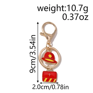 Detail view of ambulance and fire hat charms keychain with weight and size dimensions