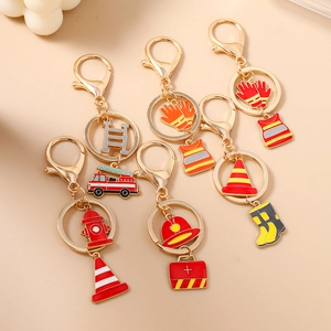 Creative firefighter keychain set with alloy charms including fire truck and helmet