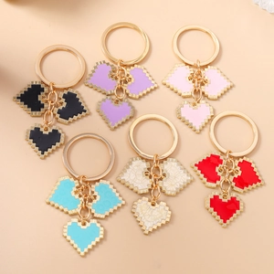 Set of 6 pixel art heart keychains in various colors with gold-tone rings for bags