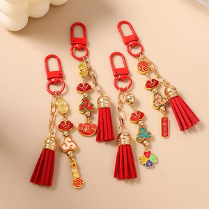 Traditional Chinese style red beaded keychains with gold charms and festive tassels