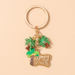 Dettaglio portachiavi dorato tropicale con palma e ciondolo Take Me To The Beach