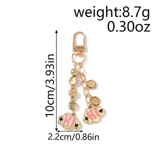 Detail view of pink enamel cloud charm keychain with Hi text and dimension markings