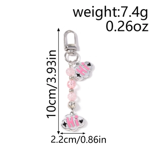 Detailed view of cloud beaded keychain with pink beads and dimensions 10cm x 2.2cm