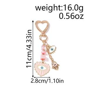 Pink heart evil eye keychain with Fatima hand charm and detailed size measurement info