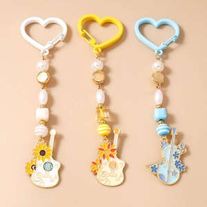 Porte-clés en Künstliche Perles Instrument de Musique Pendentif Tournesol Guitare Violon Imitation Künstliche Perle Fermoir Cœur Bijoux Cadeau