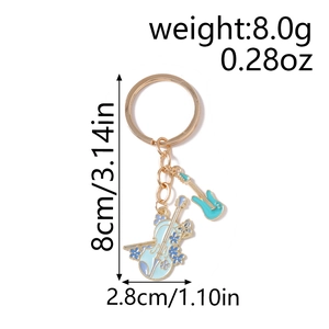 Golden musical keychain with blue enamel violin and guitar charms, length 8cm