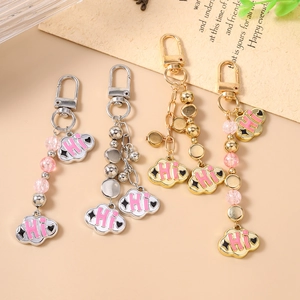 Chic cloud charms keychains with pink enamel 'Hi' pendants and beaded metal D-ring clips