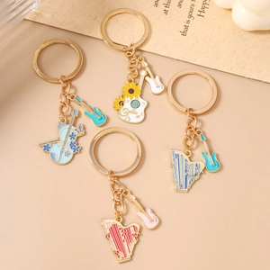 Musical instrument keychain set with guitar and harp charms in colorful enamel finish