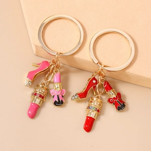 Sparkling rhinestone high heel and lipstick keychain pendant for handbags in gold finish