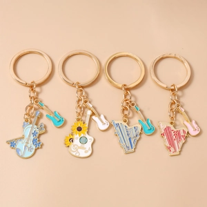 Musical instrument keychain set with violin, guitar and harp pendants in gold-plated alloy
