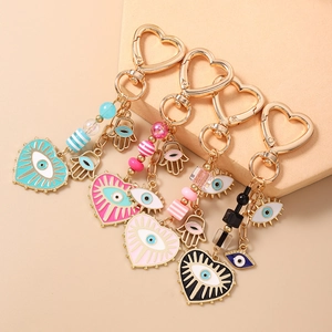 Bohemian Hamsa Hand and Evil Eye heart keychain charms in assorted vibrant colors