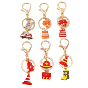 6-Piece firefighter themed keychain set with fire truck and helmet charms on white background
