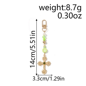 Detail showing weight 8.7g and dimensions of the green beaded cross keychain