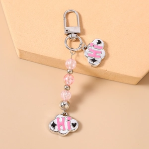Detail of pink beaded keychain with clouds, HI lettering and silver lobster clasp