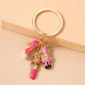 Detail of keychain featuring pink high heel and lipstick charms with sparkling rhinestones