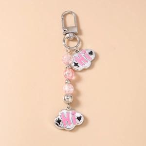Detailed view of cloud-shaped charms and pink beaded keychain with silver metal hook