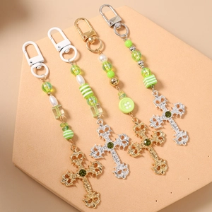 Fashionable striped beaded keychains with baroque emerald cross charms in a 4-piece set